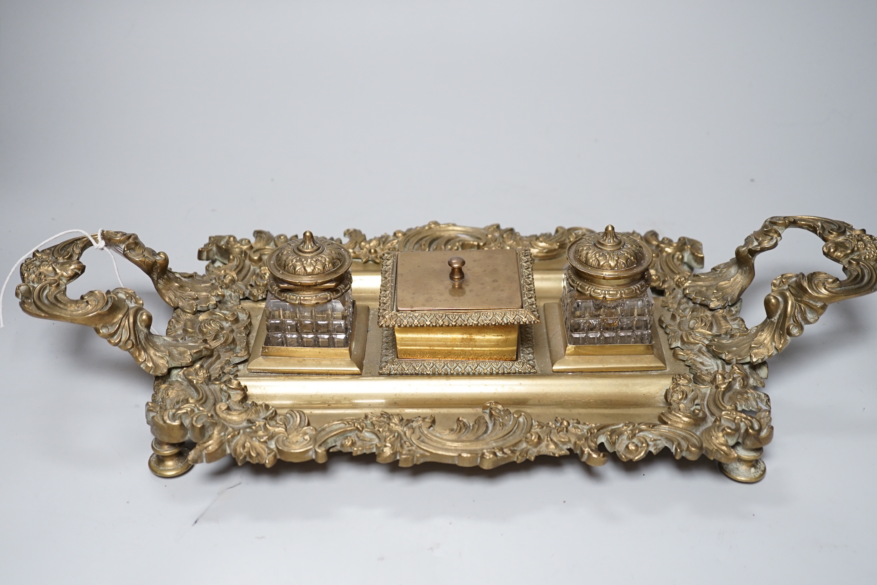 An early 20th century French cast brass desk stand, 45cm long